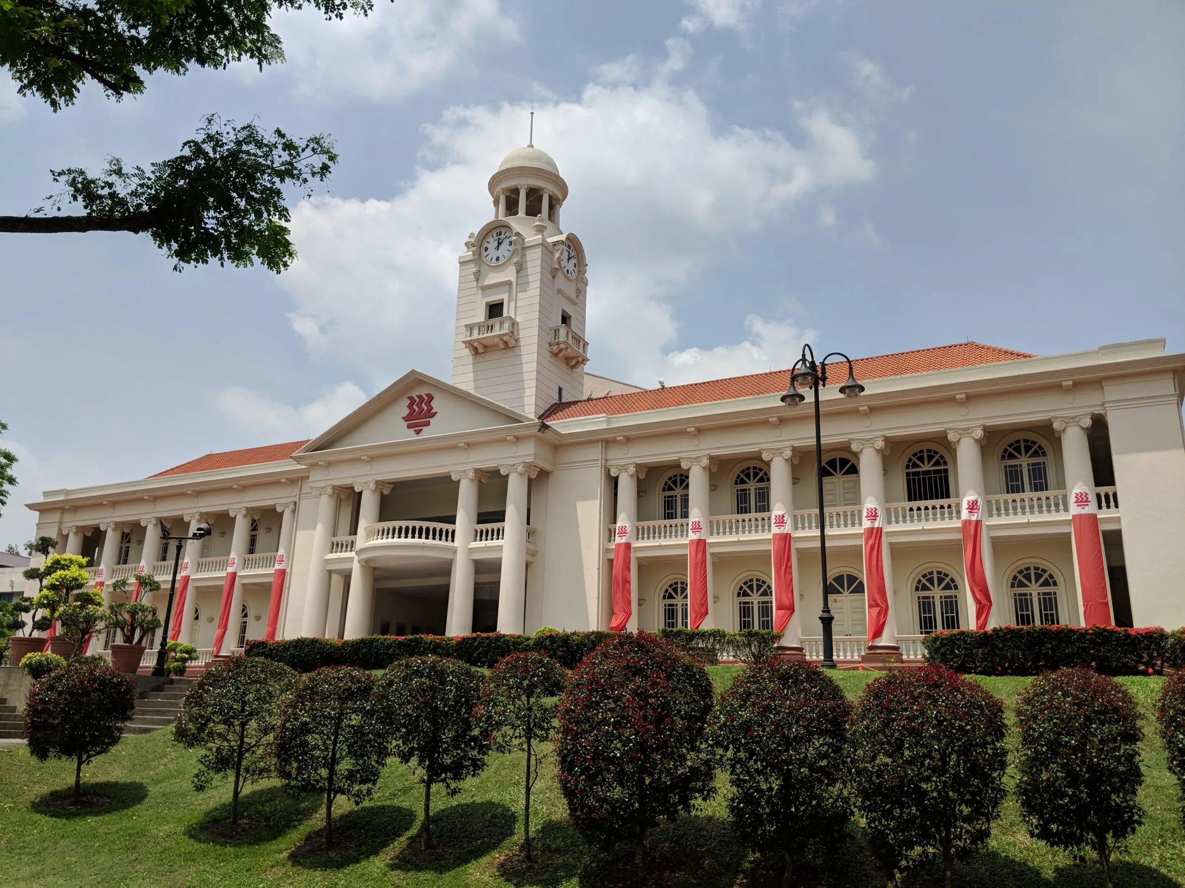 The clock tower of Hwa Chong Institution, seen across the lawn